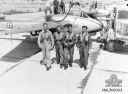 75_Squadron_RAAF_Vampire_and_pilots_in_1954.jpg